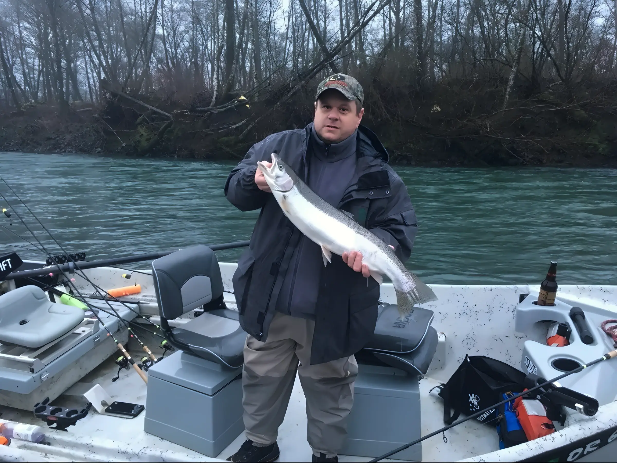 Angler holding a fish on a boat